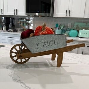 Rae Dunn wheelbarrow.